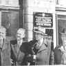 Сайк А. и  Томберг сотрудники Министерства рыбной промышленности ЭССР осматривают вывески на стене министерства -  1948